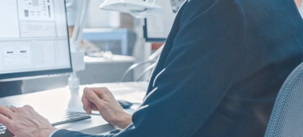 employee looking at computer screen